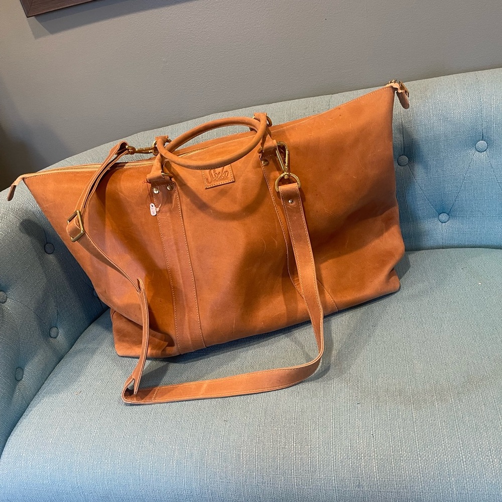 New unused leather travel bag.